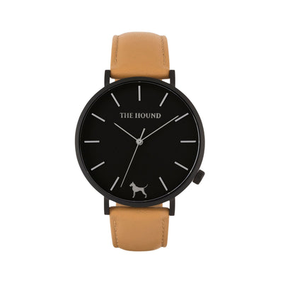 Matte black and black watch with a stitched camel genuine leather band and matte black buckle designed by THE HOUND, styled done up and shot from a front on angle.
