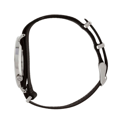 Silver and white watch with a soft black nato band and silver black buckle designed by THE HOUND, styled done up and shot from a side on angle.