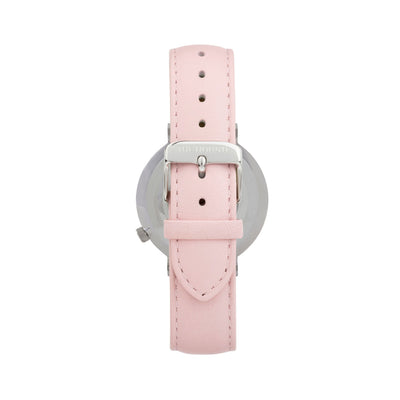 Silver and white watch with a stitched blush pink genuine leather band and silver black buckle designed by THE HOUND, styled done up and shot from behind.