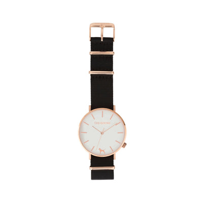 Rose gold and white watch with a soft black nato band and rose gold black buckle designed by THE HOUND, styled flat and shot from above.