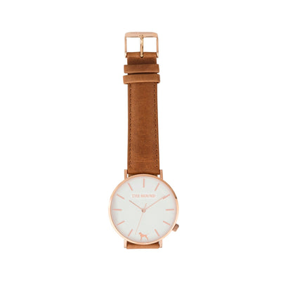 Rose gold and white watch with a stitched tan genuine leather band and rose gold black buckle designed by THE HOUND, styled flat and shot from above.