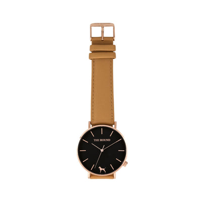 Rose gold and black watch with a stitched camel genuine leather band and rose gold black buckle designed by THE HOUND, styled flat and shot from above.